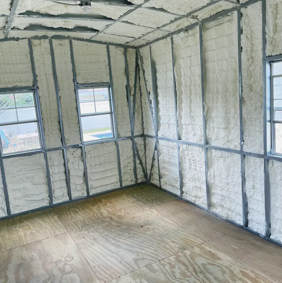 Closed-cell spray foam insulation applied to wall cavities in a residential project in Doffing